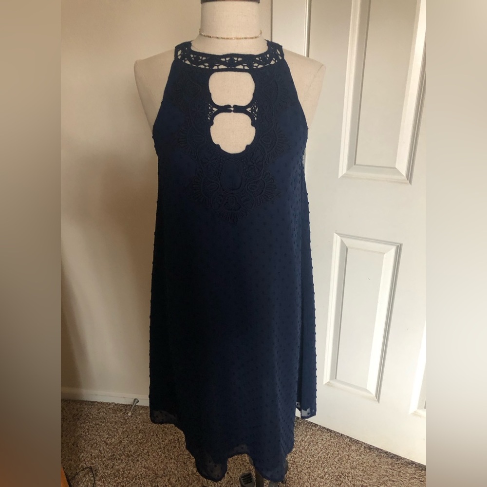 Halter silky dress with peekaboo detail.